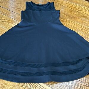 Lulu’s black fit and flare cocktail dress.  Mesh detail. Side zip. Size Medium.